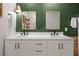 Bathroom with double vanity, decorative mirrors, and modern fixtures at 35107 Sweet Leaf Ln, Leesburg, FL 34788