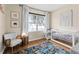 Bedroom featuring hardwood floors, a bright window, and a cozy chair at 35107 Sweet Leaf Ln, Leesburg, FL 34788
