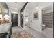 Chic entryway displaying modern decor, neutral walls, and access to a bathroom at 35107 Sweet Leaf Ln, Leesburg, FL 34788