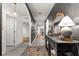 Elegant hallway features a decorative console table, stylish lighting, and neutral decor at 35107 Sweet Leaf Ln, Leesburg, FL 34788