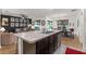 Kitchen island view showcasing an open-concept layout with modern finishes at 35107 Sweet Leaf Ln, Leesburg, FL 34788