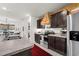 This kitchen features stainless steel appliances and warm wood accents at 35107 Sweet Leaf Ln, Leesburg, FL 34788