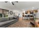 Open concept living room features bright, natural light and a view into the kitchen at 35107 Sweet Leaf Ln, Leesburg, FL 34788