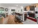 Open living space with kitchen island, dining area, and comfortable seating at 35107 Sweet Leaf Ln, Leesburg, FL 34788