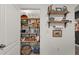 Well-stocked pantry with ample shelving and organized storage solutions at 35107 Sweet Leaf Ln, Leesburg, FL 34788