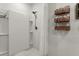 Modern all-white shower with built-in shelves and a rainfall shower head at 35107 Sweet Leaf Ln, Leesburg, FL 34788