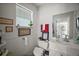Bright bathroom with white fixtures, decorated with charming wall art and decorative accents at 35350 County Road 439, Eustis, FL 32726
