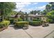 Charming single-story home with manicured landscaping, mature trees, and a spacious front yard and driveway at 35350 County Road 439, Eustis, FL 32726