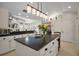 Bright eat-in kitchen with a large center island offering seating, storage and a view into the living area at 35350 County Road 439, Eustis, FL 32726