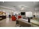 Spacious living room boasting an open layout, seamlessly connecting living, dining, and kitchen areas for versatile living at 35350 County Road 439, Eustis, FL 32726