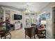 An airy living room leading to the patio through double doors, features comfortable seating and a TV at 35350 County Road 439, Eustis, FL 32726