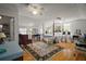 Spacious bedroom with hardwood floors, featuring a four-poster bed and ample natural light at 35350 County Road 439, Eustis, FL 32726