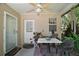 Quaint patio with outdoor seating, a small table, and decorative plants creating a cozy atmosphere at 35350 County Road 439, Eustis, FL 32726