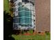 Aerial close-up of screened pool area with a spa, patio furniture and nice landscaping at 35350 County Road 439, Eustis, FL 32726