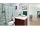 This bathroom features a tub shower combination with tropical themed shower curtain and a vanity at 356 Giovani Blvd, Clermont, FL 34715