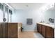 This is a full bathroom with a glass enclosed shower, double sink vanity and neutral tile floor at 356 Giovani Blvd, Clermont, FL 34715