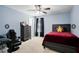 This bedroom features a ceiling fan, neutral carpet, and light blue walls at 356 Giovani Blvd, Clermont, FL 34715