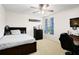 This bedroom features a ceiling fan, and ensuite bathroom and is perfect for an older  at 356 Giovani Blvd, Clermont, FL 34715