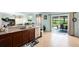 Well-equipped kitchen showcasing granite countertops, a modern sink, and an adjacent dining area at 356 Giovani Blvd, Clermont, FL 34715