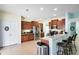 Bright kitchen features stainless steel appliances, granite counters, and a breakfast bar with seating at 356 Giovani Blvd, Clermont, FL 34715