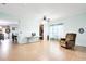 Large open living space offering tile flooring and a comfortable recliner for relaxation at 356 Giovani Blvd, Clermont, FL 34715