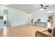 Bright and open living space features tile flooring and seamlessly connects to other areas of the home at 356 Giovani Blvd, Clermont, FL 34715