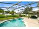Enclosed pool area features a sparkling pool, and an outdoor living space perfect for relaxing or entertaining at 356 Giovani Blvd, Clermont, FL 34715