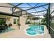 Enclosed pool area features a sparkling pool, a small area for dining, and plenty of space to lounge at 356 Giovani Blvd, Clermont, FL 34715