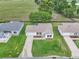 Bird's eye view of home with lush lawn, screened-in patio, and well-maintained landscaping in quiet community at 3590 Auburndale Ave, The Villages, FL 32162
