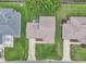 Overhead view of single Gathering home featuring well-maintained landscaping and roof, with neighboring homes at 3590 Auburndale Ave, The Villages, FL 32162