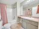 Bathroom featuring a tub with shower, vanity, and modern finishes at 3590 Auburndale Ave, The Villages, FL 32162