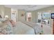 Spacious bedroom with sliding doors to the patio offers ample sunlight and comfort at 3590 Auburndale Ave, The Villages, FL 32162