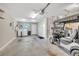 Spacious garage featuring laundry area, neutral paint, a golf cart, and plenty of room for parking and storage at 3590 Auburndale Ave, The Villages, FL 32162