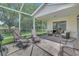 Spacious screened lanai with comfortable seating, perfect for relaxation and enjoying the outdoors at 3590 Auburndale Ave, The Villages, FL 32162