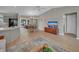Open concept living space with hardwood floors, dining area, and kitchen for modern living and entertaining at 3590 Auburndale Ave, The Villages, FL 32162