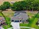 Gorgeous aerial view highlighting the property's pristine landscaping, fenced yard, and serene backyard pool area at 3733 Statham Dr, Apopka, FL 32712