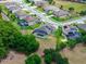 An aerial shot of a residence with pool, lawn, landscaping, and surrounding neighborhood at 3733 Statham Dr, Apopka, FL 32712