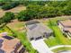 Extensive aerial view featuring the property's landscaped grounds, bordered by fencing, with solar panels on the neighbor's roof at 3733 Statham Dr, Apopka, FL 32712