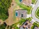 An aerial view of a home showcasing a backyard pool and a well-manicured lawn at 3733 Statham Dr, Apopka, FL 32712