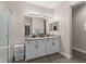 Well-lit bathroom featuring double vanity, granite countertops, and a glass-enclosed shower at 3733 Statham Dr, Apopka, FL 32712