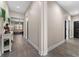 Hallway boasts wood-like tile flooring and leads to the rest of the home at 3733 Statham Dr, Apopka, FL 32712
