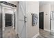 Hallway with wood-look tile flooring, modern paint colors and barn-style doors at 3733 Statham Dr, Apopka, FL 32712
