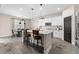 Stylish kitchen with white cabinets, granite countertops, stainless steel appliances, and an island with seating at 3733 Statham Dr, Apopka, FL 32712