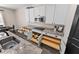 Well-organized kitchen boasts modern appliances, granite countertops, and custom pull-out drawers for efficient storage at 3733 Statham Dr, Apopka, FL 32712
