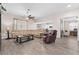 Spacious living room with modern flooring, neutral paint, ceiling fan and an open floorplan at 3733 Statham Dr, Apopka, FL 32712