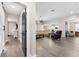 Hallway opens up to an open-concept kitchen and living room at 3733 Statham Dr, Apopka, FL 32712