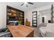 Home office features expansive desk, library, and a comfortable sitting area at 3733 Statham Dr, Apopka, FL 32712