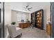 Office space featuring built-in bookcase, ladder, and wood desk at 3733 Statham Dr, Apopka, FL 32712