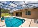 A refreshing pool area with a screened enclosure complements the home's exterior at 3733 Statham Dr, Apopka, FL 32712