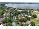 An aerial shot showcasing the property's location near a stunning lake and lush greenery at 421 W 10Th Ave, Mount Dora, FL 32757